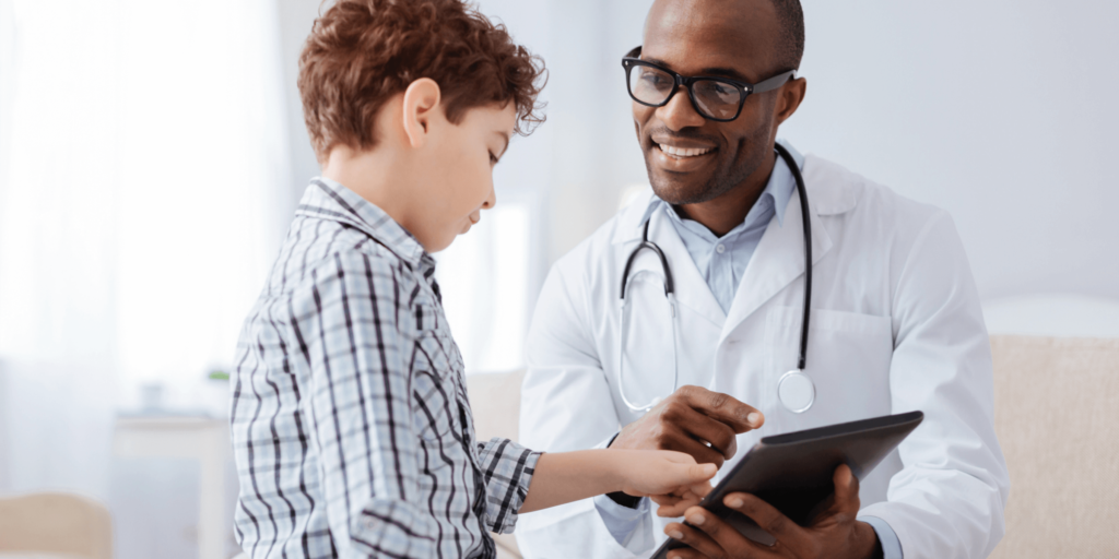 The doctor is talking to a boy