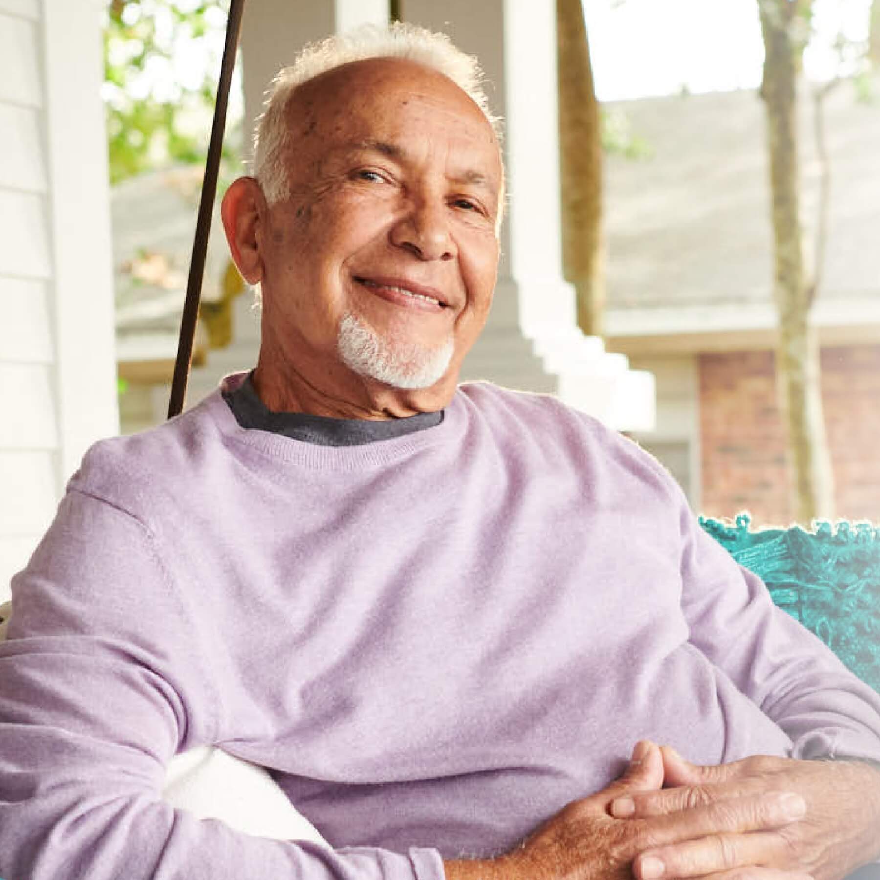 smiling man sitting on the terrace