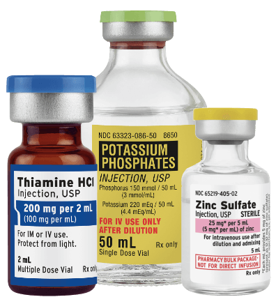 Vials of injectable supplements including Thiamine HCl, Potassium Phosphates, and Zinc Sulfate