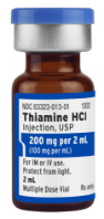 A medical vial with a label that reads "Thiamine Hydrochloride Injection, USP." The label also shows other smaller text details.